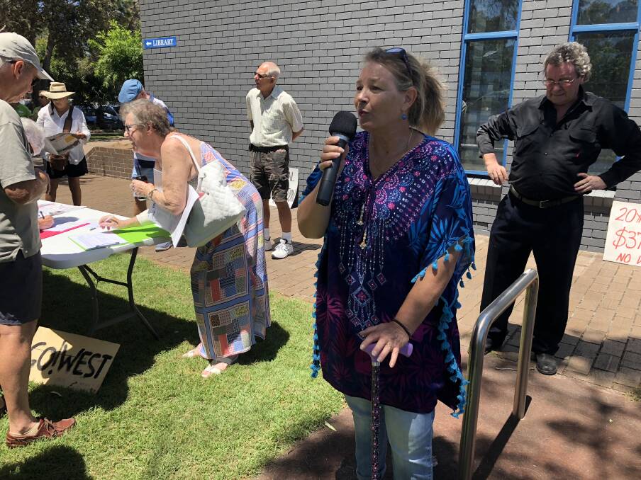 Katrina Pearson addresses protesters during a rally in front of Forster council chambers in February.