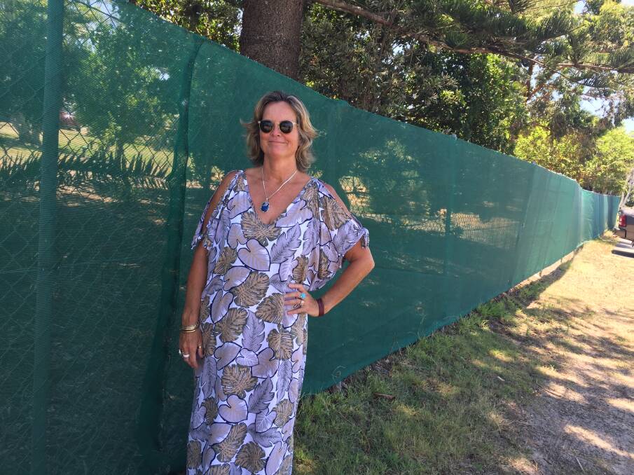 Friends of Tuncurry spokesperson, Leanne Jeffries is asking why the shade-cloth covered cyclone fence has not been removed.