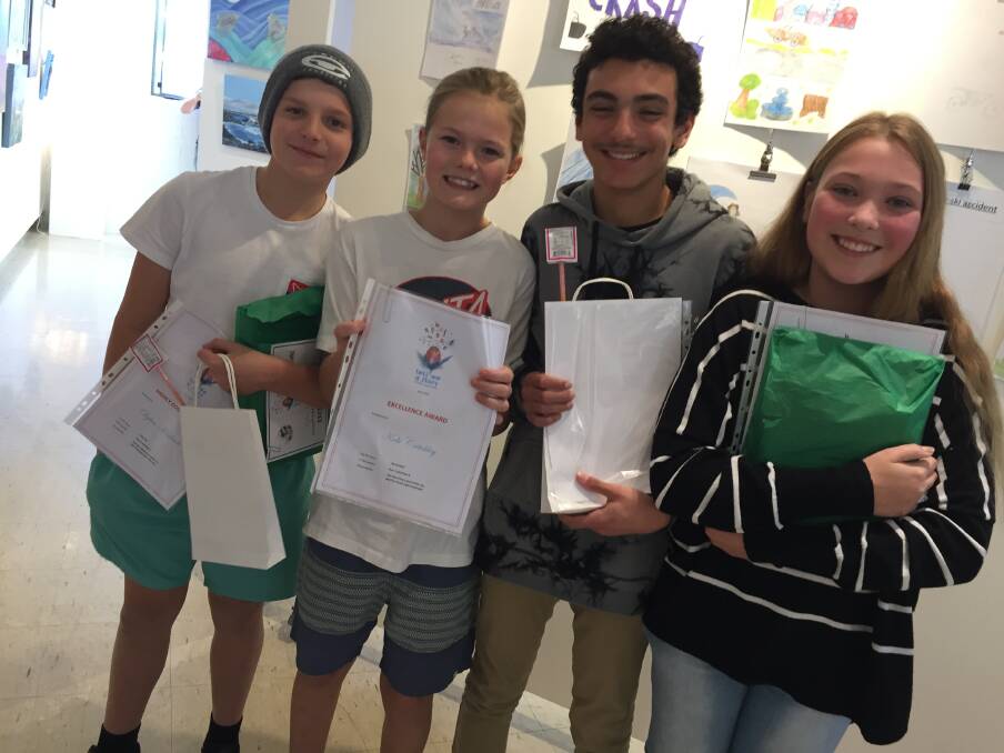 Holy Name Primary School students, Dylan Kinkade, Kobi Critchley, Jonathan Botros and Hannah Atkinson received excellence and highly commended awards in the writing competition.