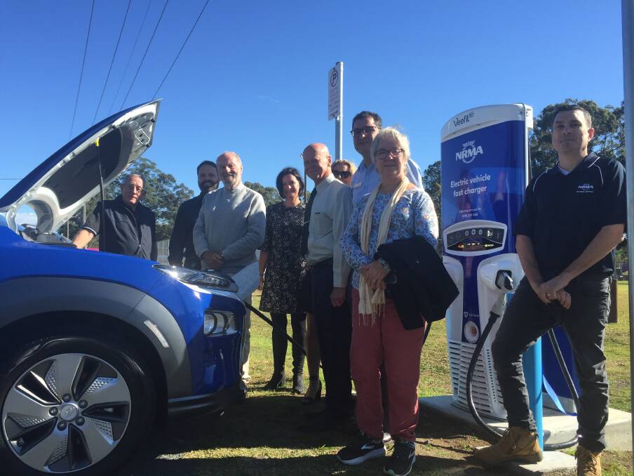 Elspeth Cronin, David West, MidCoast Council general manager, Adrian Panuccio, along with members of the Nabiac Futures Group at the EV launch.