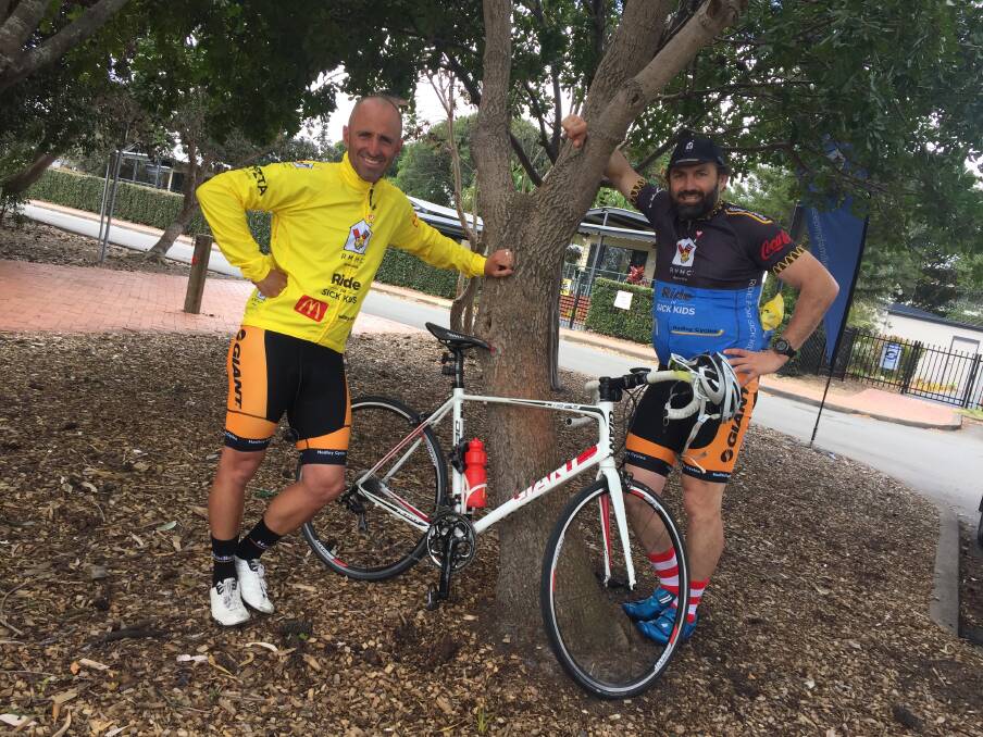  Nathan Chiswell from Coffs Harbour and Pete Hodgson take a well earned break in Forster before returning to Taree.