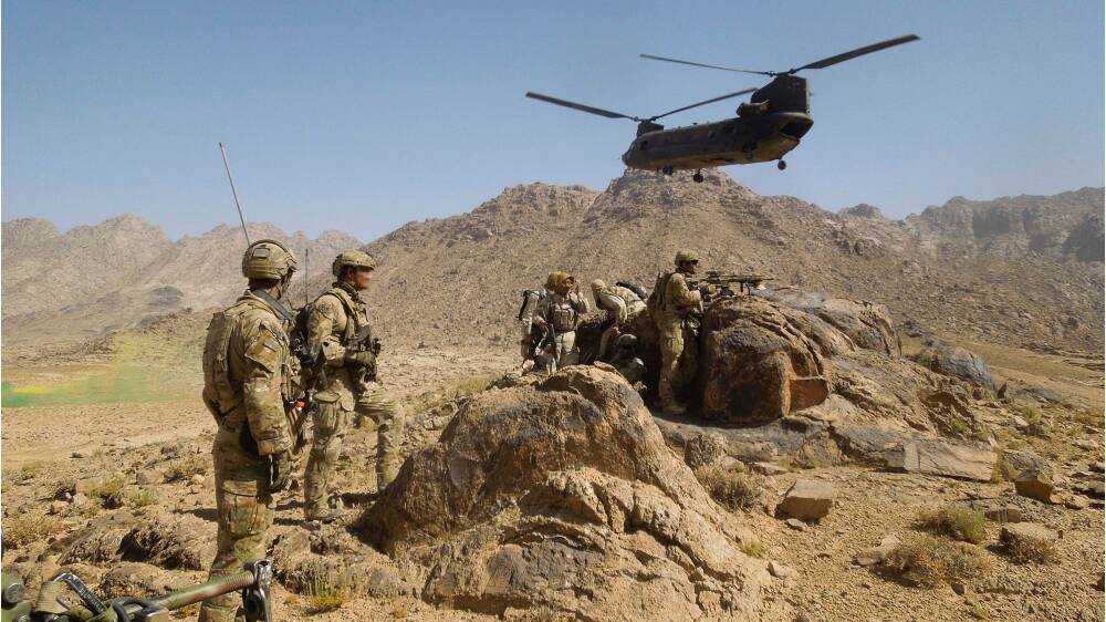 Australian Army soldiers from Special Operations Task Group establish a position after disembarking a US Army CH-47 Chinook helicopter with their Afghan National Security Force partners at the start of a cordon and search mission in Kandahar province, southern Afghanistan, in 2012. Picture: Department of Defence