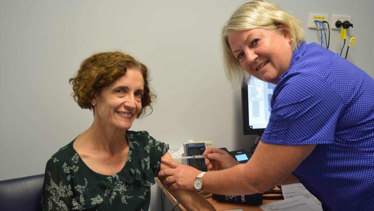 Dr Michele Hogg received the first COVID vaccination at Gloucester Medico administered by registered nurse Sue Wallace.