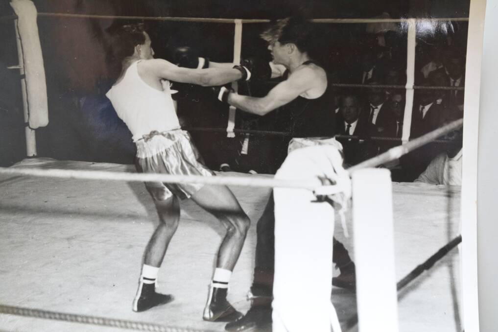 Bill Booth (on the left) in his final match in 1965 against Brian Hobbs, a sailor Bill said he knocked out in about a minute. Photo supplied by Bill Booth