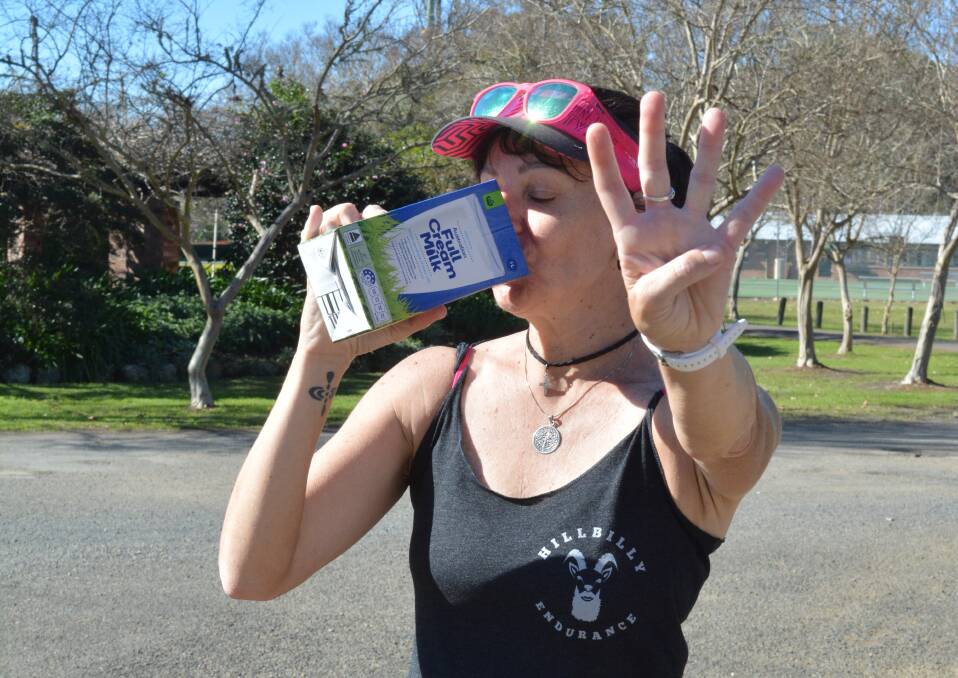 Karin Tappouras drinking her beloved milk after completing her fourth marathon run. Photo Anne Keen 