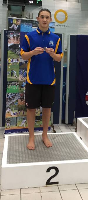 Raffa Francesci at the medal presentation ceremony for Combined High Schools in 100m butterfly race. 