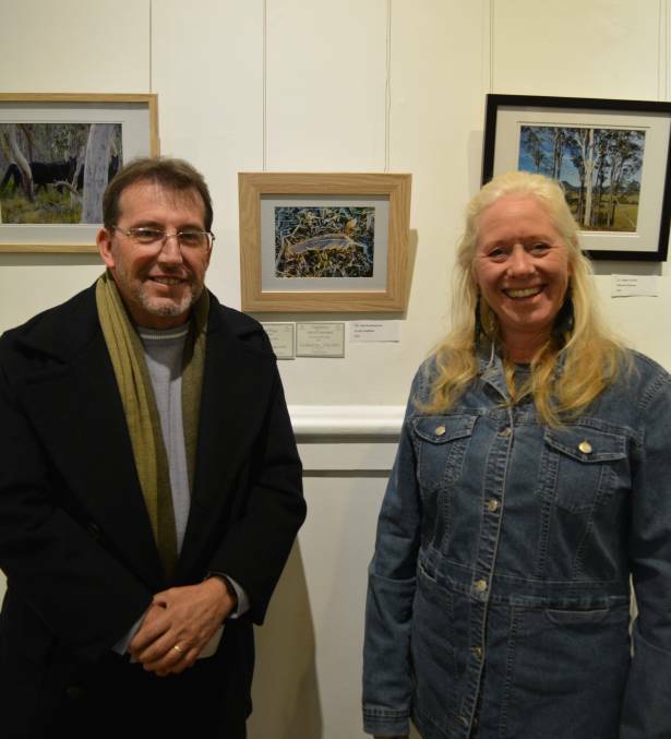 2018 Pix from the Stix judge Stephen Barry with major prize winner, Lea McKinnon and her photograph "Frosty feather". 