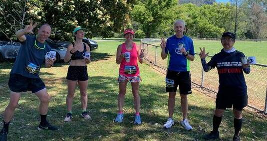 Karin (Kaz) Tappouras stands between four of the runners in the Triple Bucketts Marathon Series Challenge on day three. Photo supplied