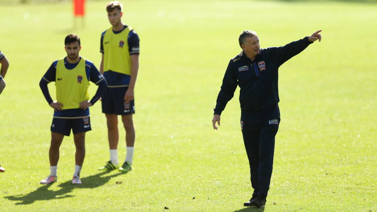 Newcastle Jets coach Ernie Merrick barks orders at a training session. They will be in Port Macquarie next month. Photo: Jonathan Carroll