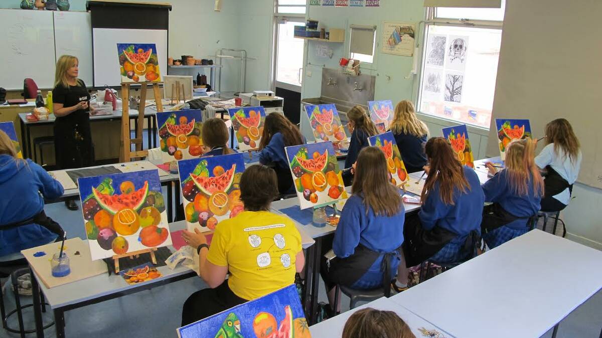 Donna Rankin teaching the Heart To Heart program. For eight weeks female students participate in painting classes, learning mindfulness and improving their confidence and ability to open up in the proccess. 