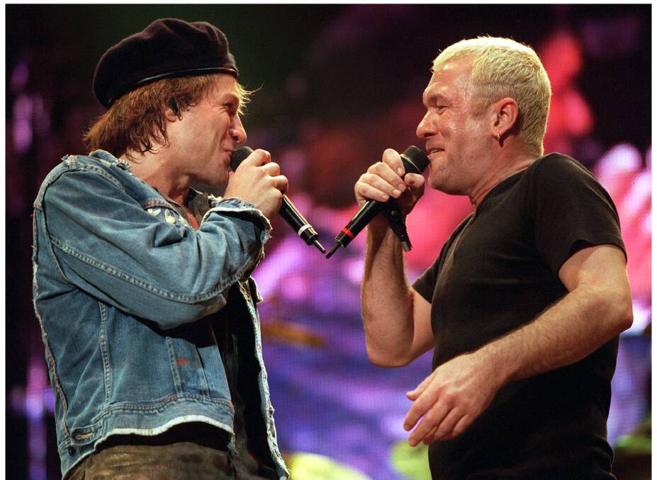 ROCKING NIGHT: Jimmy Barnes performing with Bon Jovi at Melbourne's Docklands Stadium in 2001. 