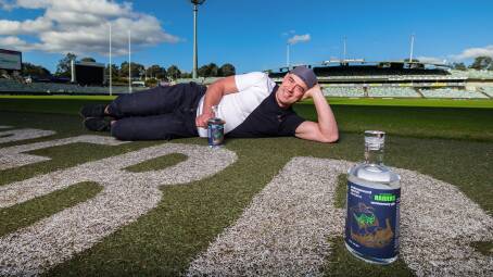 Former Canberra Raiders player Terry Campese with the Underground Spirits' gin for the club's 40th anniversary. Picture: Sitthixay Ditthavong