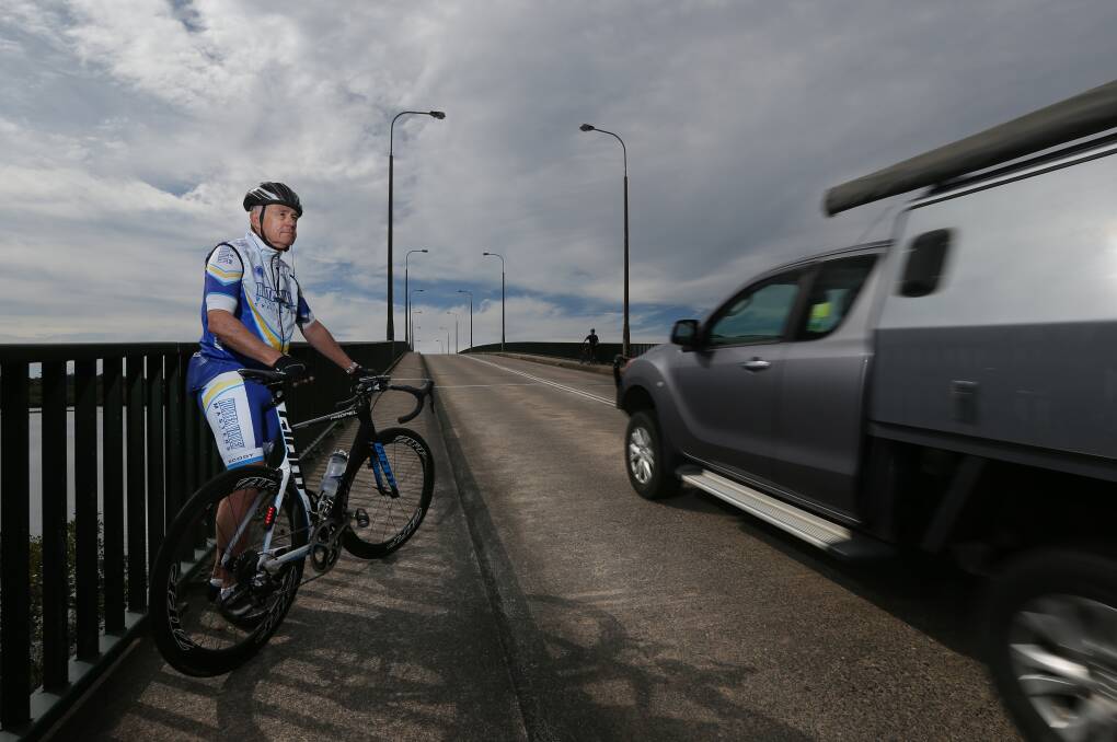Hazard: Hugh Jones rides over the Singing Bridge every day and is used to being told to get off the road. He says many motorists are not aware that they are required to share the bridge with cyclists. Picture: Simone DePeak 