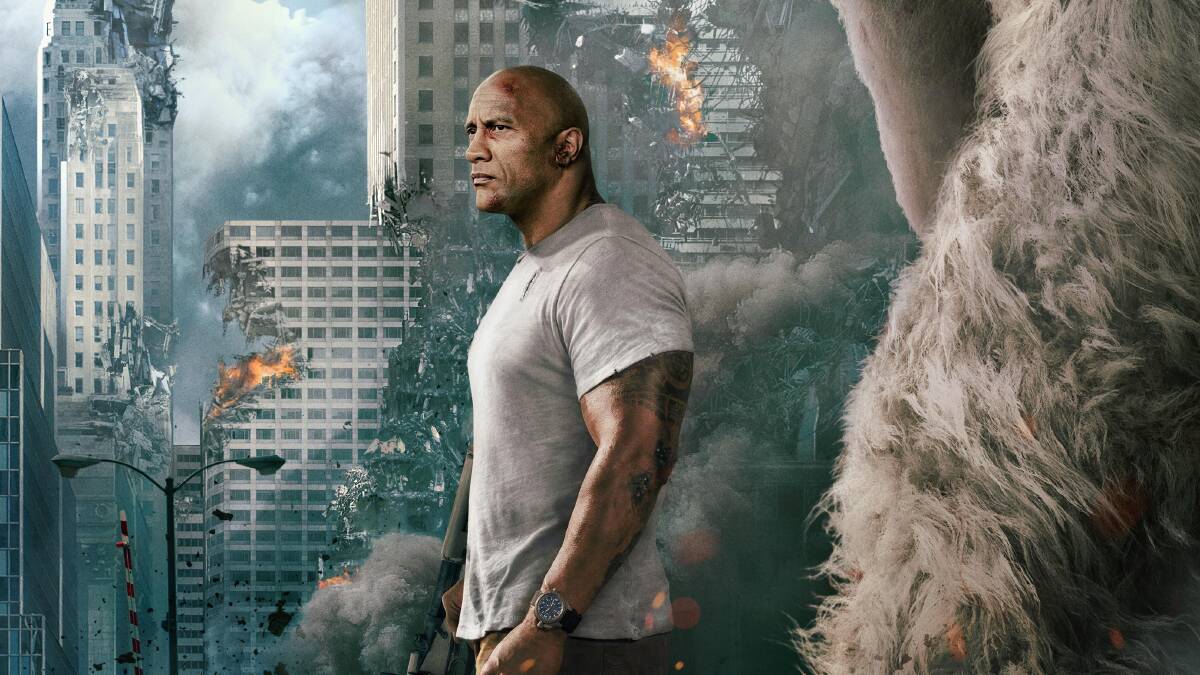Massive: Destruction aplenty by rampaging monster animals leads star Dwayne Johnson on a quest to find an antidote to the genetic mutation which made his gentle gorilla George into one of them. Photo: New Line Cinema
