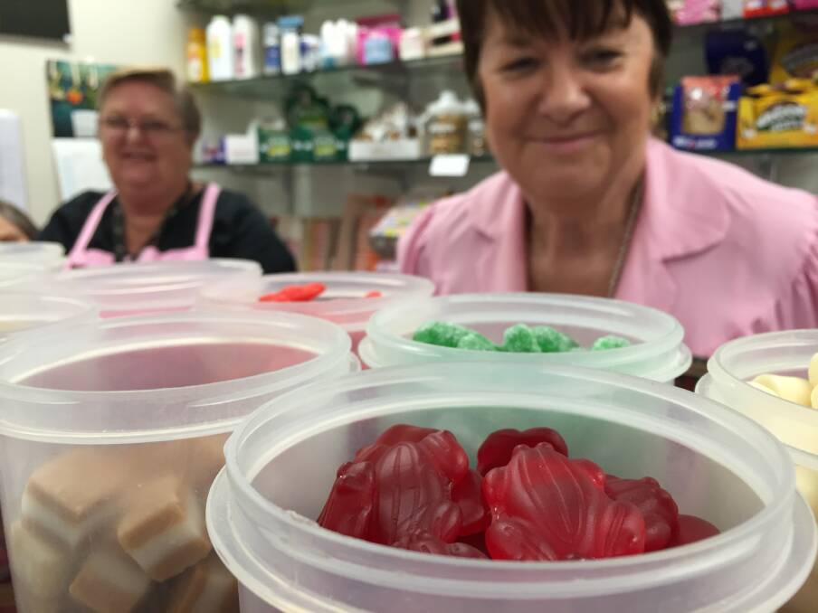 Pink Ladies president Corinne Lang (right) says red frogs are consistently the favourite lolly of Manning Hospital kiosk customers.