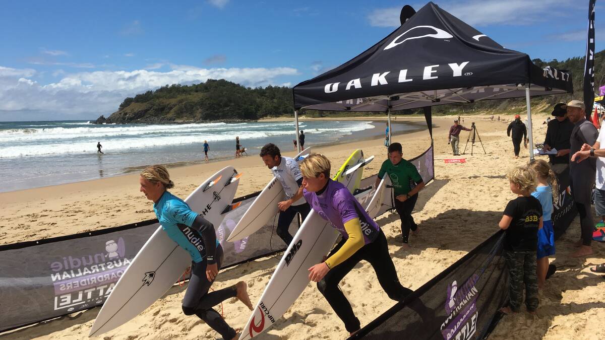 Mick Moltzen (white) gets things started for the Boomerang Beach Boardriders.