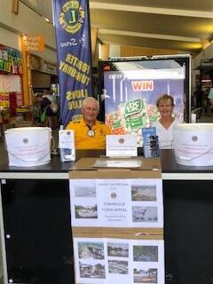 Lions Club members Greg Butterworth and Margaret Maher help raise money for the Queensland flood relief appeal.