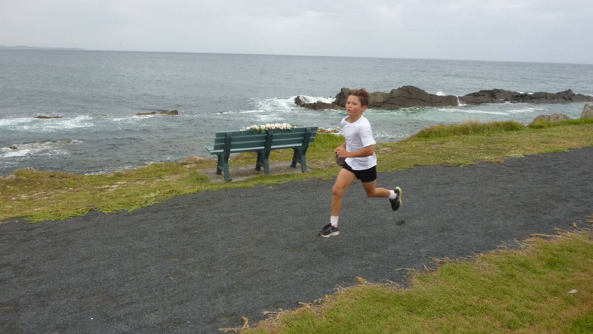 Winner of the nine-year-old boys division, Khan Penney, in full stride at Pebbly Beach. 