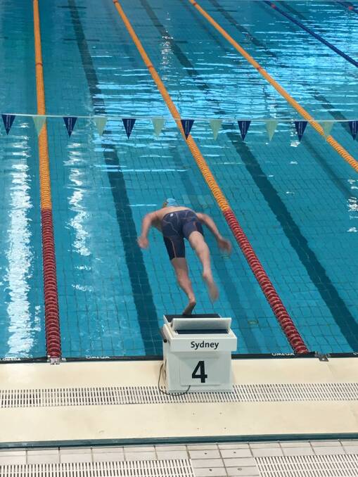 Nash Wilkes on his way to setting a new State record at the NSW All Schools Secondary Swimming Championships.
