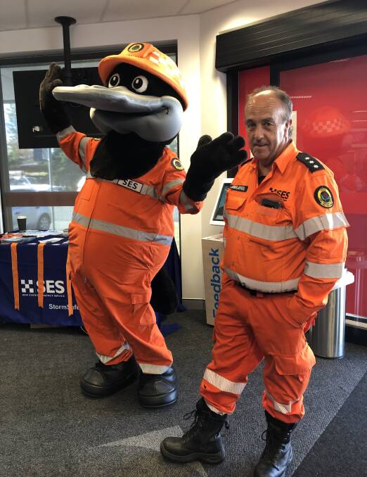 Paddy the Platypus and Greg Dodd of the SES enjoying Wear Orange Wednesday at Service NSW, Tuncurry.