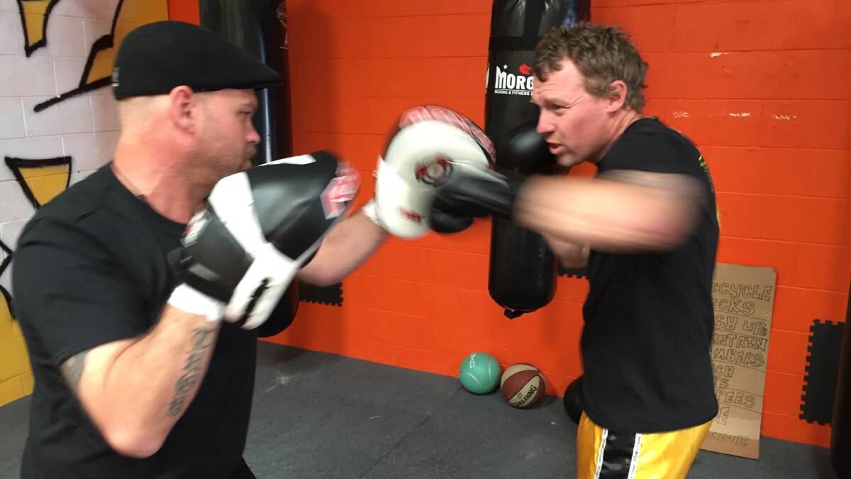 Shane works the pads for middleweight boxing prospect and childhood friend, Ben Pascoe.