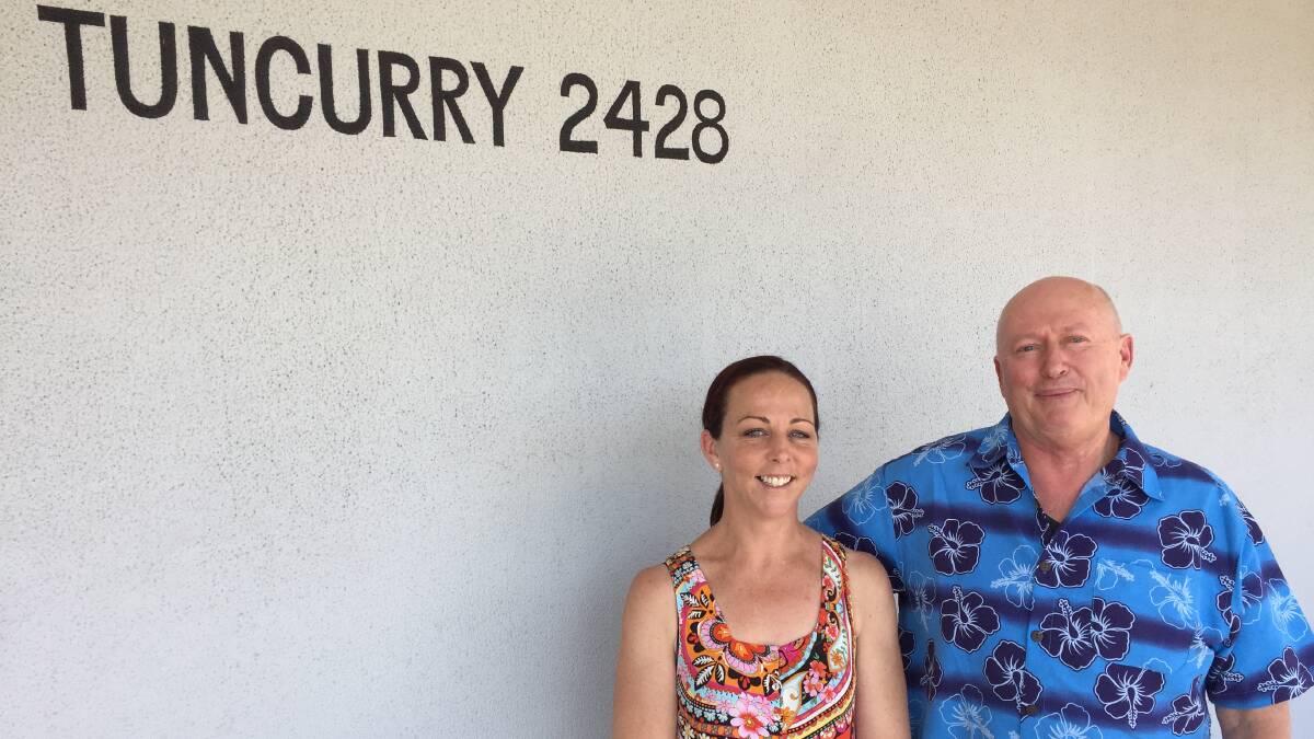 The mural planned for the Tuncurry Post Office has received a setback due to the current water restrictions. Pictured is project coordinator Cheyce Kneller and post office licensee Warwick Thompson.