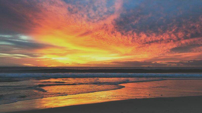 Sunrise over Nine Mile Beach, Tuncurry. Photo: Louie Love.