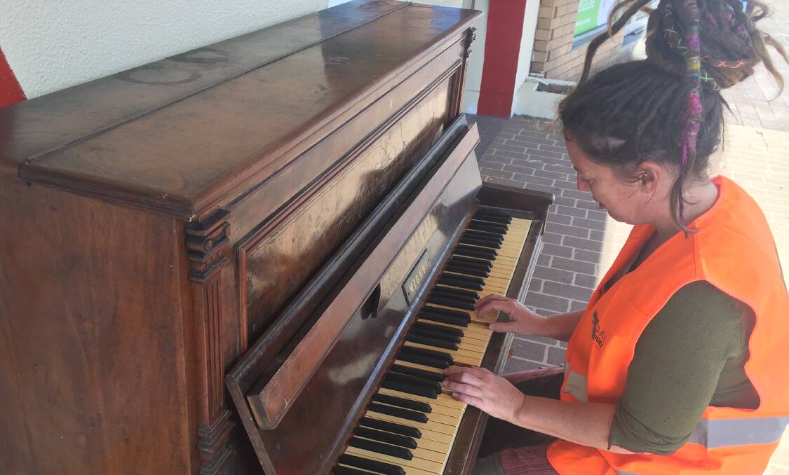 Tuncurry resident Rachel Love bangs out a tune on Manning Street's new piano.