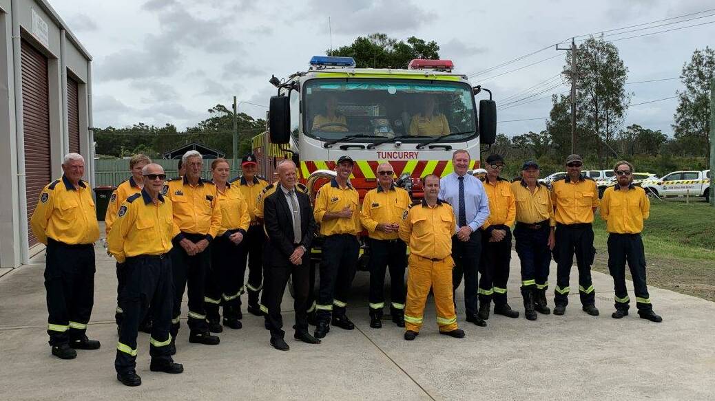 Tuncurry RFS volunteers with Stephen Bromhead, David West and Guy Duckworth at the presentation of the brigade's new tanker.