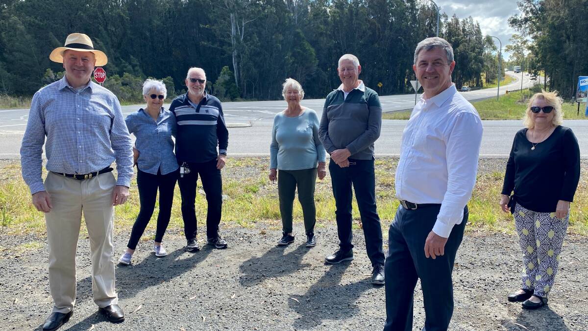Local members Stephen Bromhead and David Gillespie with Hallidays Point community members at the intersection of The Lakes Way and Blackhead Road.