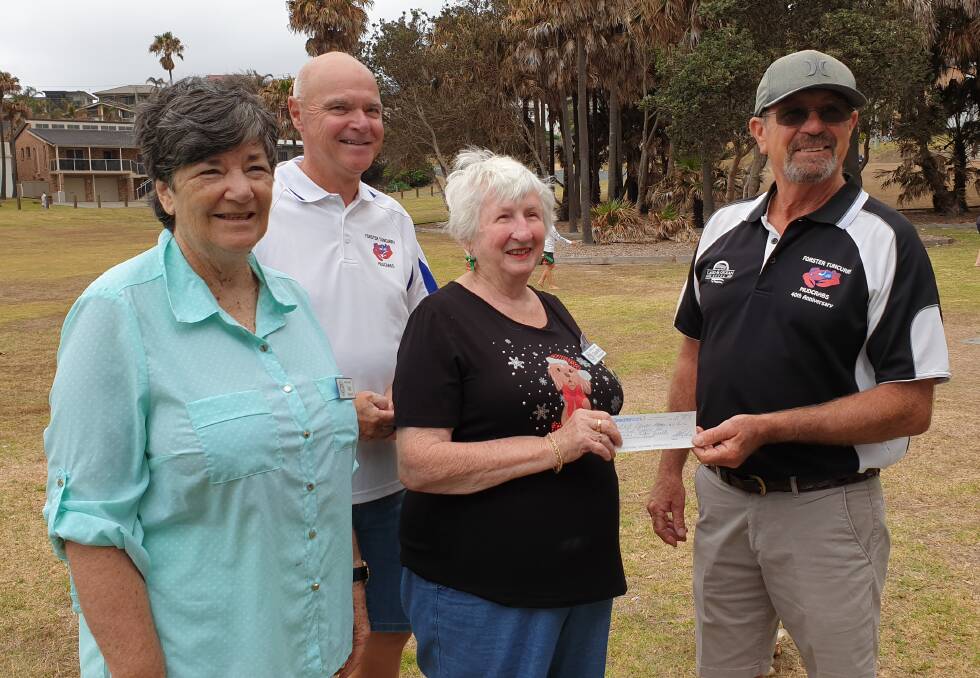Kerry Matheson and Alan Wilson of the Forster Tuncurry Mudcrabs present Jan Peasnell and Sandra Thurgood of the Country Women's Association with a cheque for the Disaster Relief Fund.