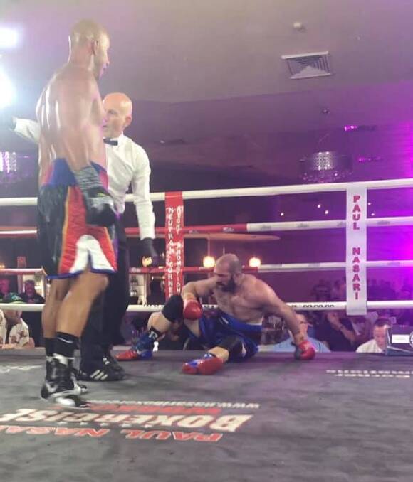 Shant 'Boomerang' Nercessian stands over Jeff King after knocking him down in the second round.