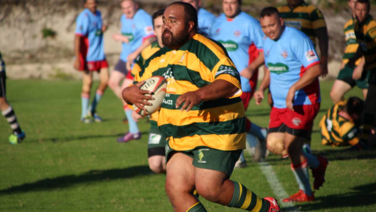Dolphins front-rower, Lorenzo Latu, striding out against the Clams at Peter Barclay Field, Tuncurry. Photo by Sue Hobbs.
