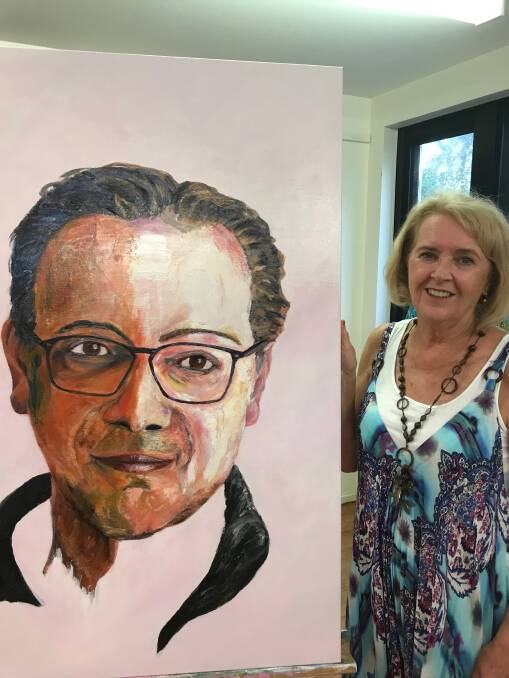 Trisha Fitzpatrick with her painting of Dr Michael Zacharia for the 2019 Archibald Prize.