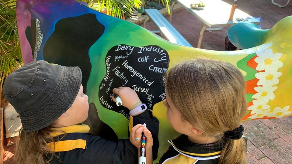 The students were responsible for helping to design and decorate the cow.