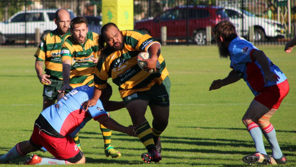 Dolphins' wrecking ball Lolo Latu in an earlier game against Old Bar. Photo by Sue Hobbs.