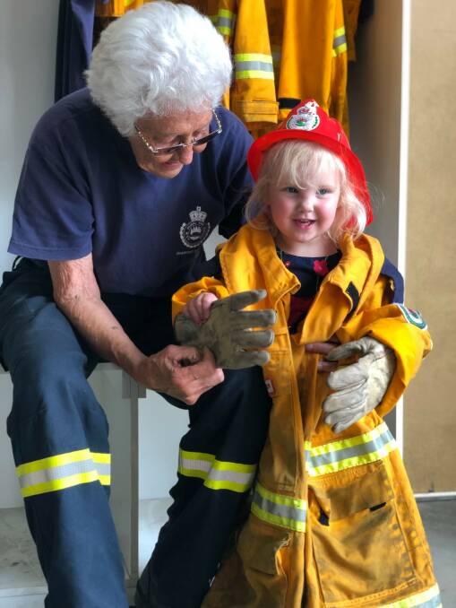 Firefighter meets child.