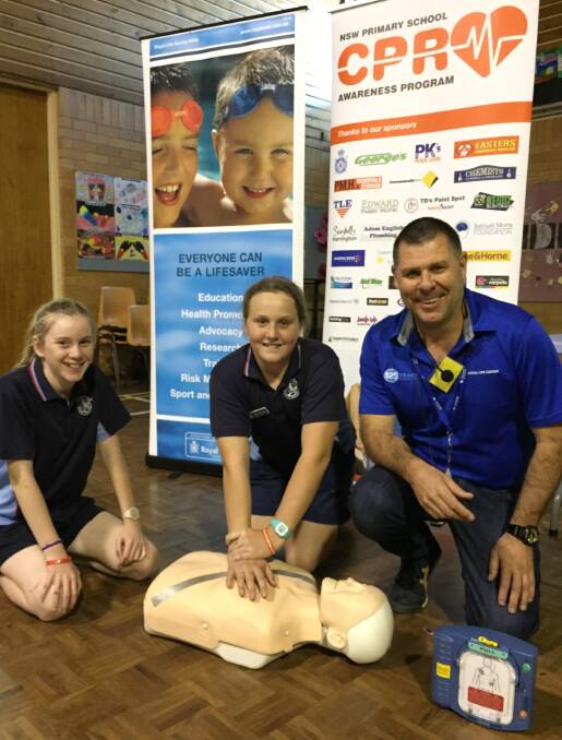 Forster Public School Year 6 students Bella Burgess and Asher Nelson with NSW Primary School CPR Awareness Campaign instructor, Cameron McFarlane.
