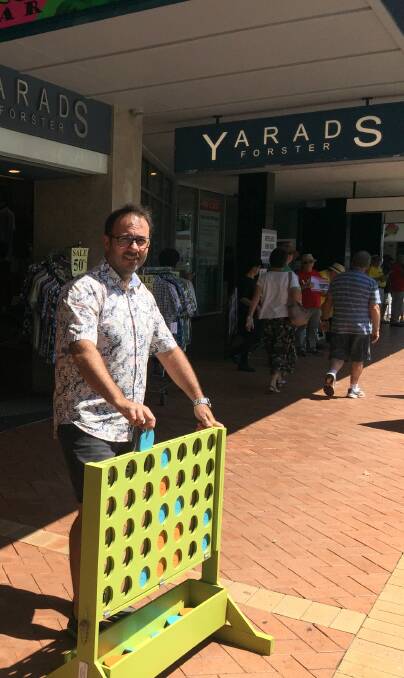 Michael Yarad of Yarads Menswear believes wooden games like Connect Four have created a positive energy in Wharf Street.