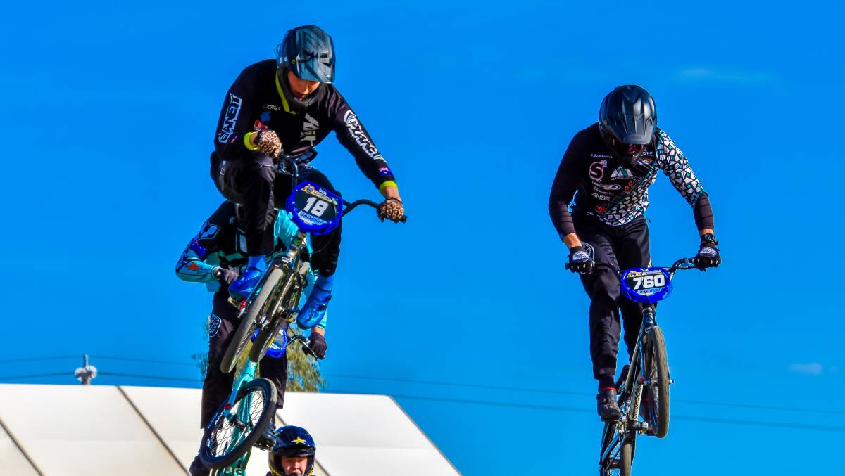 Oli Moran (no 18) flying towards a podium finish in the Junior Elite class at the 2019 BMXA BAD BOY National Championships in Shepparton, Victoria. Photo by Get Snapt/BMX Australia.
