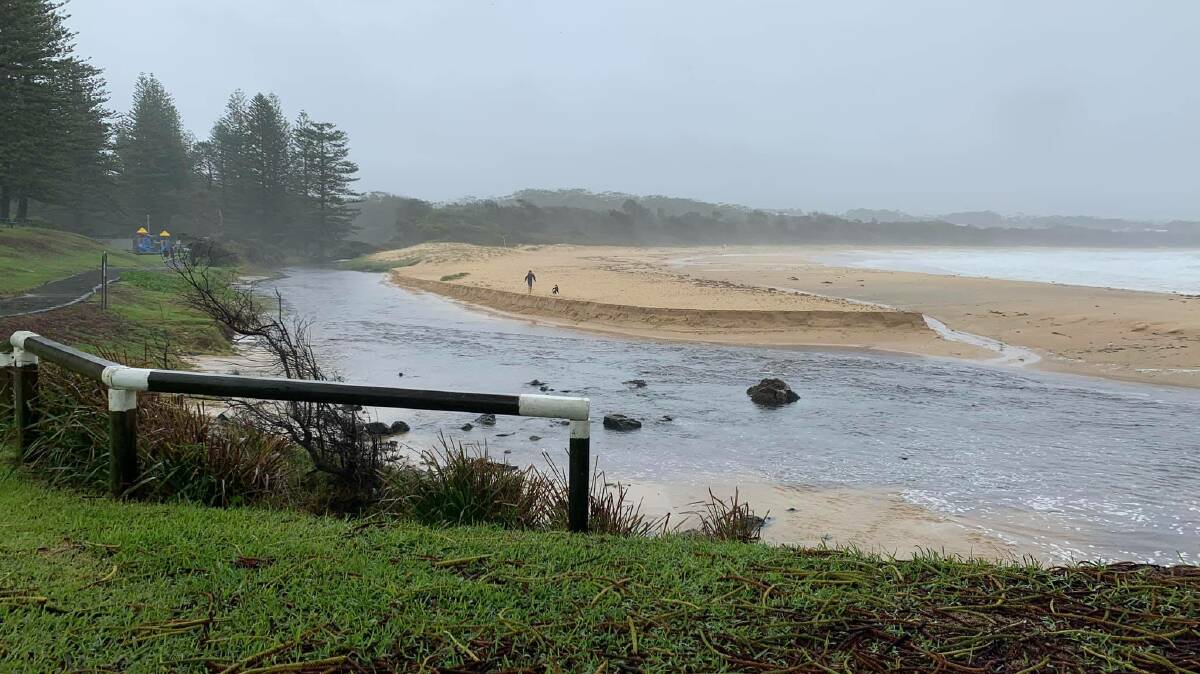 The creek at Black Head Beach busted open in the heavy rain on Friday.