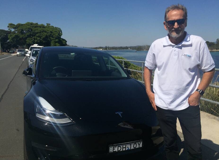 Peter Mannow with his beloved Tesla Model 3.