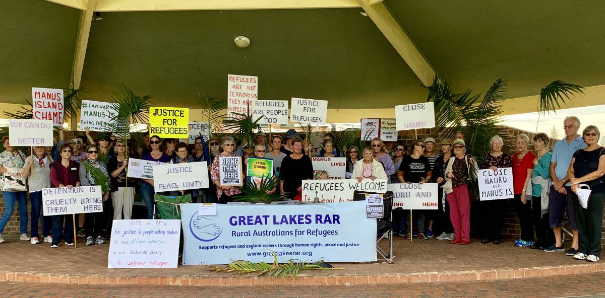 Local Rural Australians for Refugees members gather for a special Palm Sunday rally for refugees.
