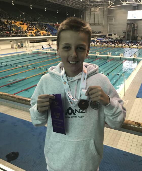 Harrison Tancred showing off his haul from the NSW Junior State Age Championships.