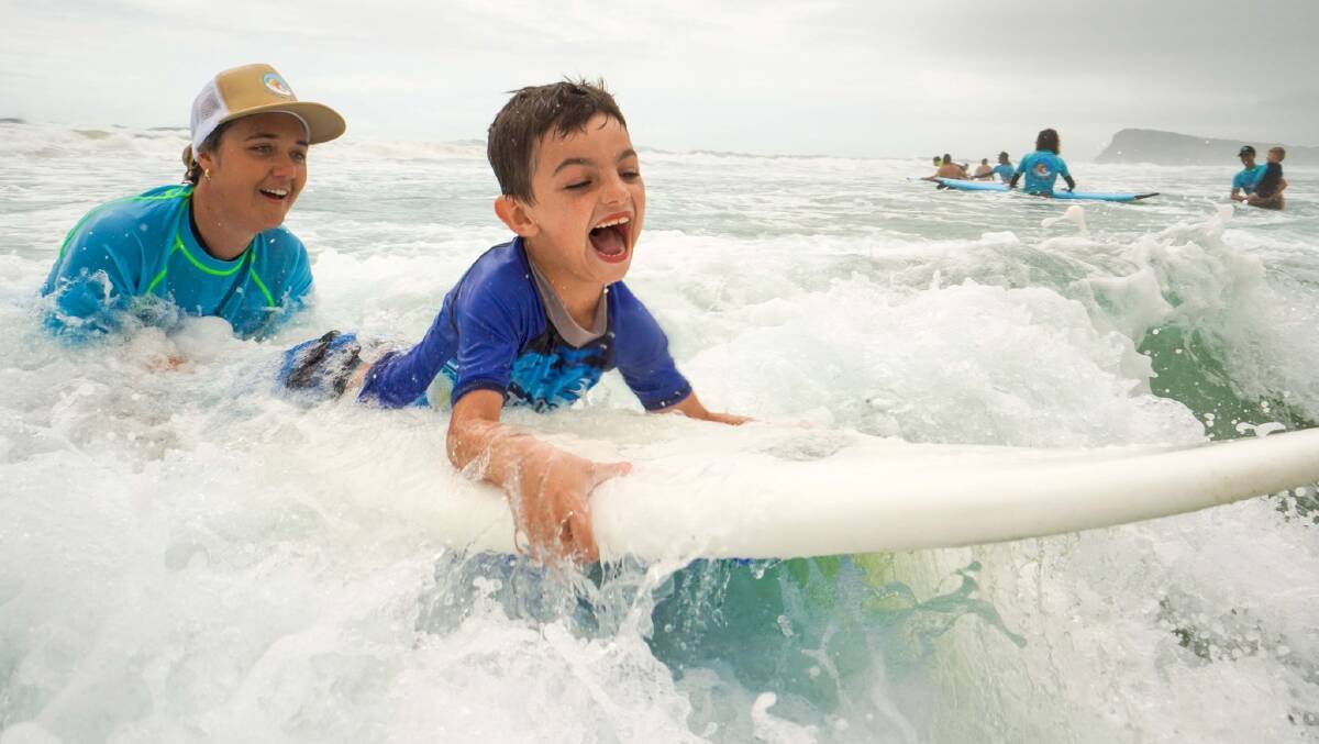 Surfing the Spectrum offers kids with autism the opportunity to experience the therapeutic benefits of surfing. Photo by Drew Snyder.