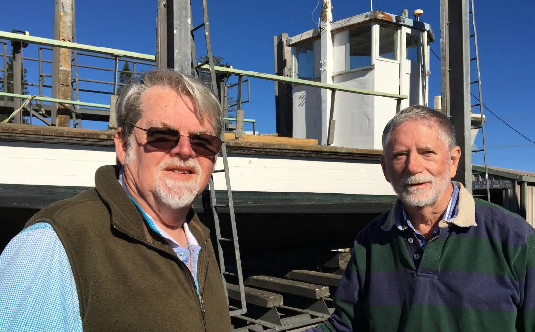 Graham Nicholson and Chris Borough standing in front of the Tuncurry Slipway at John Wright Park, where so much of the area's rich shipping history began.