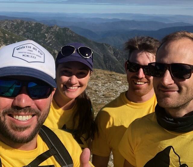 Penni Darcy with fellow Coles managers from around NSW at the top of Mount Kosciuszko.