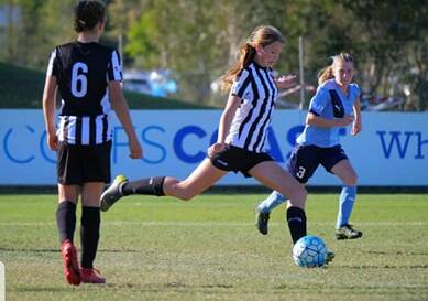 Bungwahl's Ginger Harrison sends the ball up the field for Northern NSW.