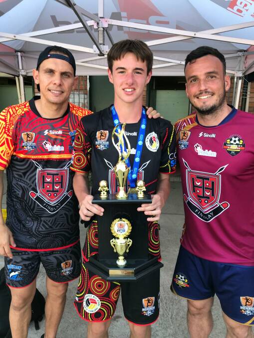 Riley with high profile indigenous football stars, Jade North and Mark Bridge.