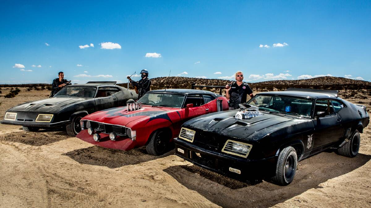 Dee Vyper with his Mad Max 2 XA Falcon in between clients Bill Brown and Michael Hoffman. Photo by Ben Hoffman.
